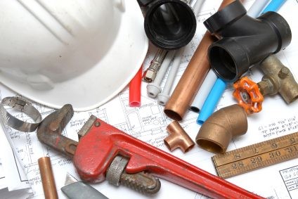 Plumbing parts, tools, and plans used by What's Next Emergency Response.